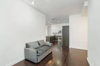 a living room with a couch and a kitchen at Downtown LA with the breathtaking view 2 bedrooms and parking space in Los Angeles