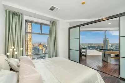 a bedroom with a bed and a view of a city at Downtown LA with the breathtaking view 2 bedrooms and parking space in Los Angeles