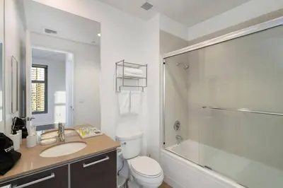 a bathroom with a toilet and a sink and a shower at Downtown LA with the breathtaking view 2 bedrooms and parking space in Los Angeles