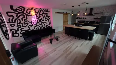 a living room with a couch and a table at 2BR Lit and Spacious in the Heart of Hollywood in Los Angeles