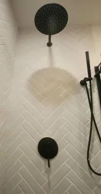 a bathroom with a shower with a shower head at 2BR Lit and Spacious in the Heart of Hollywood in Los Angeles
