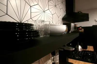 a counter with glasses on it with a wall at 2BR Lit and Spacious in the Heart of Hollywood in Los Angeles