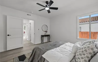 a bedroom with a ceiling fan and a bed at Modern 2-Bedroom in Santa Moinca Area Close to UCLA in Los Angeles