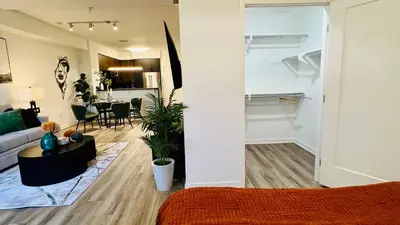 a living room with a couch and a table at Luxury Open BD w Pool, Parking, & WD 133 in Los Angeles