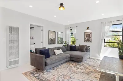 a living room with a couch and a table at Bohemian Beach ## in Los Angeles