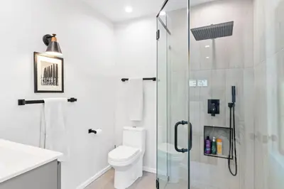 a bathroom with a toilet and a glass shower at Bohemian Beach ## in Los Angeles