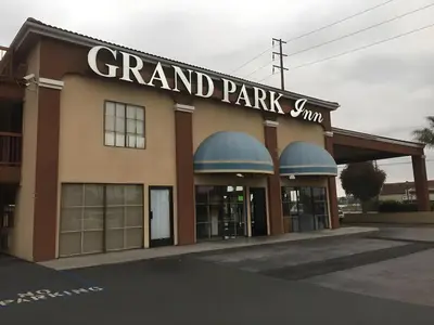 a grand park inn building with a sign on it at Grand Park Inn in Baldwin Park
