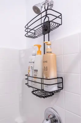 a rack with three bottles of soap on a wall at Comfy and Stylish 4 Bathrooms 26 in Ridgecrest