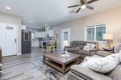 a living room with two couches and a table at Luxury, Style and Comfort 4 Bathrooms 21 in Ridgecrest