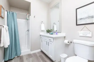 a bathroom with a shower toilet and a sink at Refreshing and Spotless 4 Bathrooms 22 in Ridgecrest