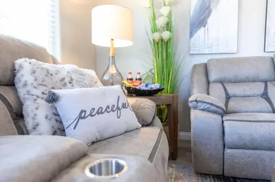 a living room with a couch and a chair at Refreshing and Spotless 4 Bathrooms 22 in Ridgecrest