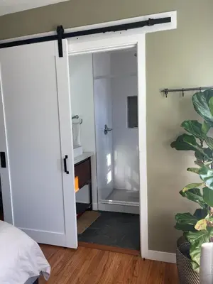 an open door to a bathroom with a shower at Inglewood Forum and Sofi park and walk private room in Inglewood