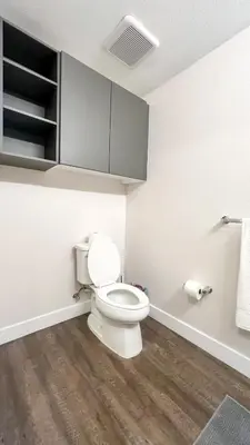 a bathroom with a white toilet in a room at Stunning Hollywood Sign View in Los Angeles