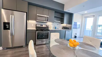 a kitchen with a table with oranges on it at Stunning Hollywood Sign View in Los Angeles