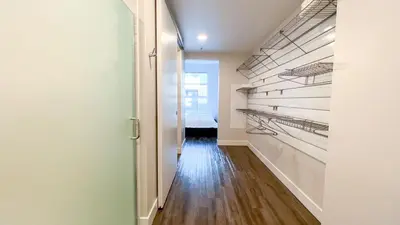 a hallway with empty shelves in a apartment at Stunning Hollywood Sign View in Los Angeles