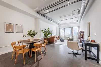an open living room with a table and chairs at Downtown Escape - 2BR w Skyline Views & Hot Tub in Los Angeles