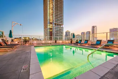 a swimming pool on the roof of a building at Downtown Escape - 2BR w Skyline Views & Hot Tub in Los Angeles
