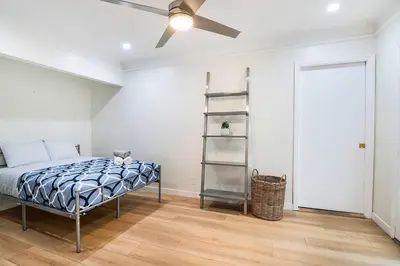 a bedroom with a bed and a ceiling fan at Updated 3-Bedroom LA Home with Backyard, BBQ & Family-Friendly Amenities in Los Angeles