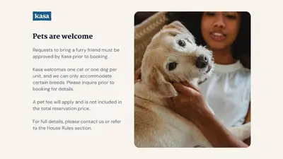 a woman holding a puppy in her hands at City Center Hotel By Kasa in Long Beach