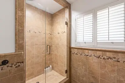 a bathroom with a shower with a glass door at Modern Oasis with Pool & Jacuzzi near Universal Studios in Los Angeles