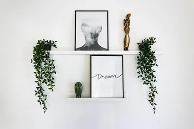 a white shelf with two pictures and a cactus at Modern Oasis with Pool & Jacuzzi near Universal Studios in Los Angeles