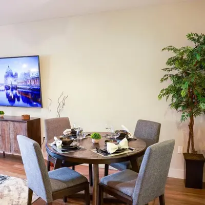 a dining room with a table and chairs at 1 Bedroom XL Condo with King bed, Garden View, Parking Included in Los Angeles