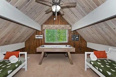 a room with a ping pong table in a house at Lake Arrowhead Fishermans Haus in Lake Arrowhead