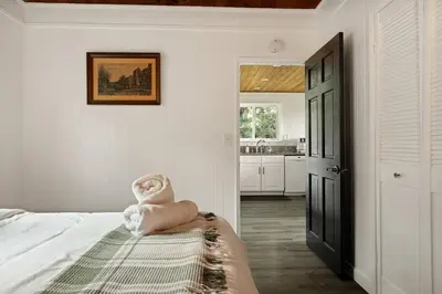 a bedroom with a bed with a towel on it at Quiet Mountain Cabin in Lake Arrowhead