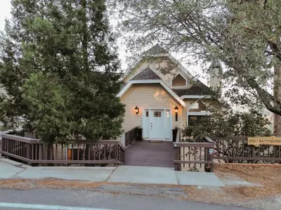 a house with a wooden ramp leading to a door at Lake Arrowhead Matterhorn Views in Lake Arrowhead