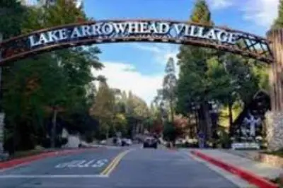a sign that reads lake arrowhead village over a road at The Muddy Moose- Spacious Family Getaway in Lake Arrowhead