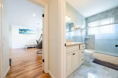 a bathroom with a tub and a toilet and a sink at 17-19ppl BTW Dsny Hllywd GarageParking Yard Grill in Monterey Park