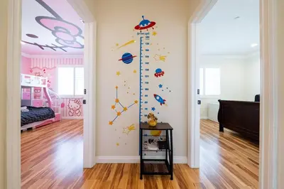a childs room with a wall mural of planets at 17-19ppl BTW Dsny Hllywd GarageParking Yard Grill in Monterey Park