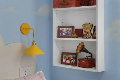 a white shelf with pictures and a lamp in a room at Pixar Pier by OC Adventure Homes in Anaheim