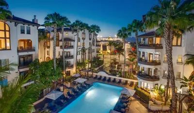 an aerial view of a hotel with a swimming pool and palm trees at Modern Apartment in Trendy Area in Los Angeles