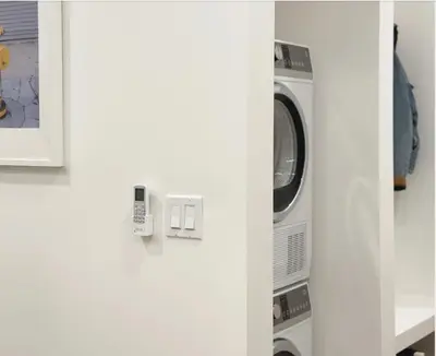 a washer and dryer sitting in a room at Broskin apartments in Los Angeles