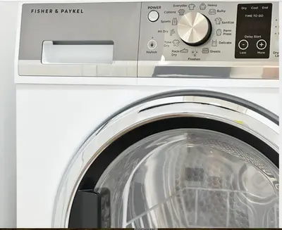a white washing machine with its door open at Broskin apartments in Los Angeles