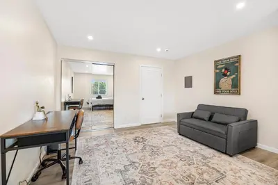a living room with a couch and a table at Central Hollywood Apartment in Los Angeles