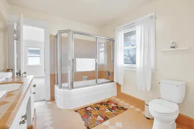 a bathroom with a shower and a toilet at Classic Home Near Downtown & Hollywood in Los Angeles