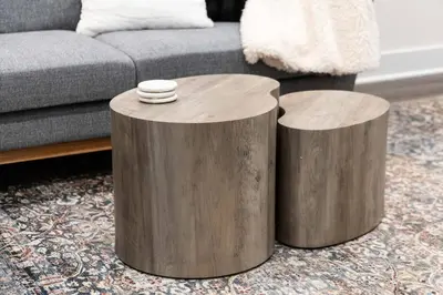 two wooden stump tables in a living room with a couch at Luxe Townhouse Near Downtown LA in Los Angeles