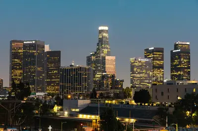 a city skyline at night with tall buildings at Spectacular Rooftop View House in Los Angeles