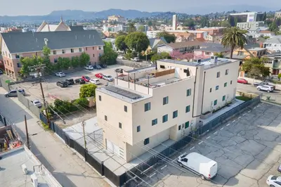 an overhead view of a white building in a city at Spectacular Rooftop View House in Los Angeles