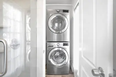 a washing machine and a washer and dryer in a room at Valley Ranch With Pool in Los Angeles