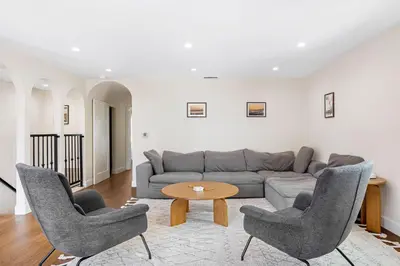 a living room with a couch and two chairs and a table at Venice Beach Villa in Los Angeles