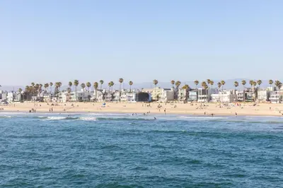 a beach with a lot of people and buildings at Venice Beach Villa in Los Angeles