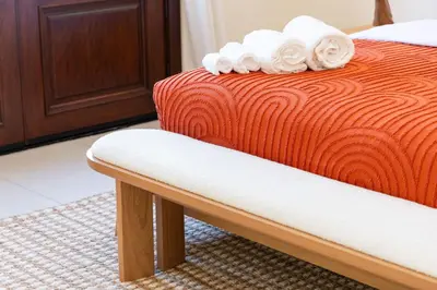 a bed with white towels on top of it at Venice Beach Villa in Los Angeles