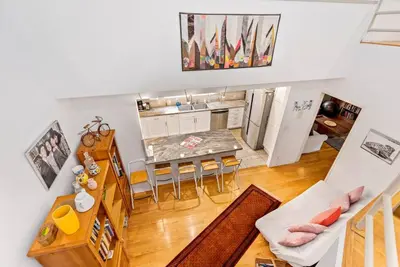 an overhead view of a kitchen and a living room at House on the canal in Venice in Los Angeles