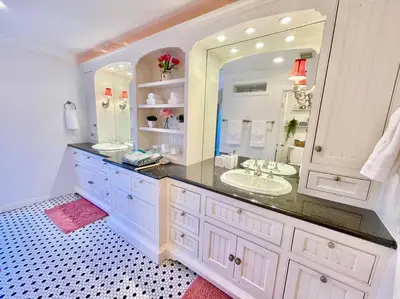 a bathroom with a sink and a large mirror at New Charming Spacious Disneyland Pool Home in Garden Grove