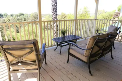 two chairs and a table on a porch at GREAT VIEWS - Over the Oaks - Stylish - Whole Home in Thousand Oaks