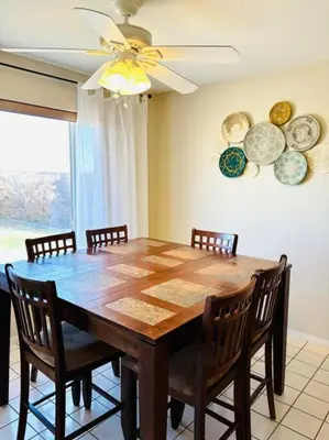 a dining room table with chairs and plates on the wall at Silver Lakes Oasis with Resort Style Amenities in Helendale