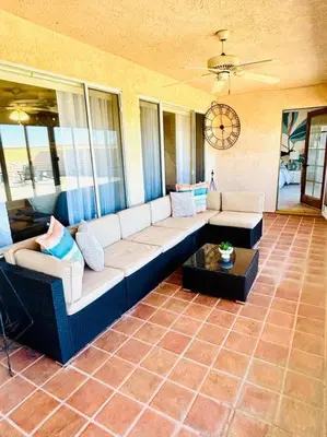 a living room with a couch and a table at Silver Lakes Oasis with Resort Style Amenities in Helendale